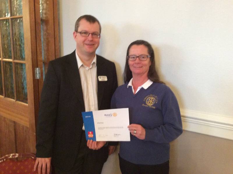 Rotary Club of Forres Past President Doreen McCaig receives the certificate. 