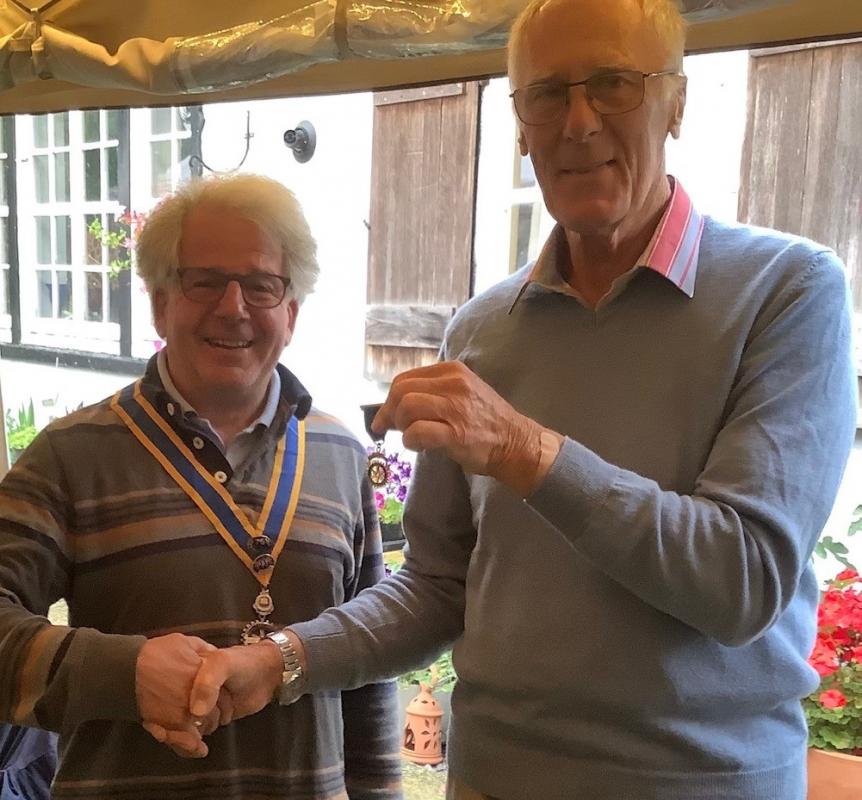Peter Wellington hands over the Presidency to David Langdon and receives his Past President medal.