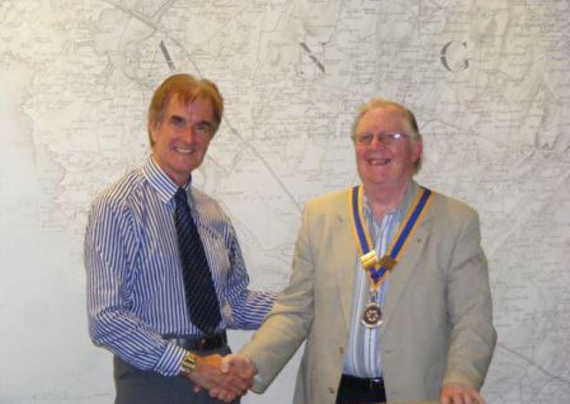 Immediate Past President Trevor Parry hands over to the 2013 President, Richard Lloyd at the Club Assembly on the 24 June 2013.