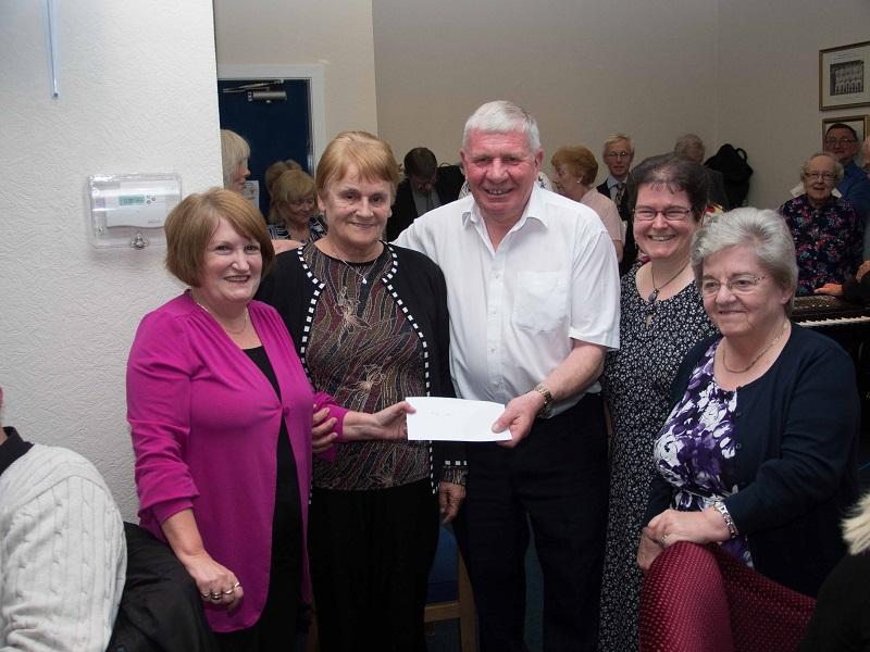 A Late Summer Soiree - Members of Port Glasgow URC Foodbank receive a donation from President Bill Knox