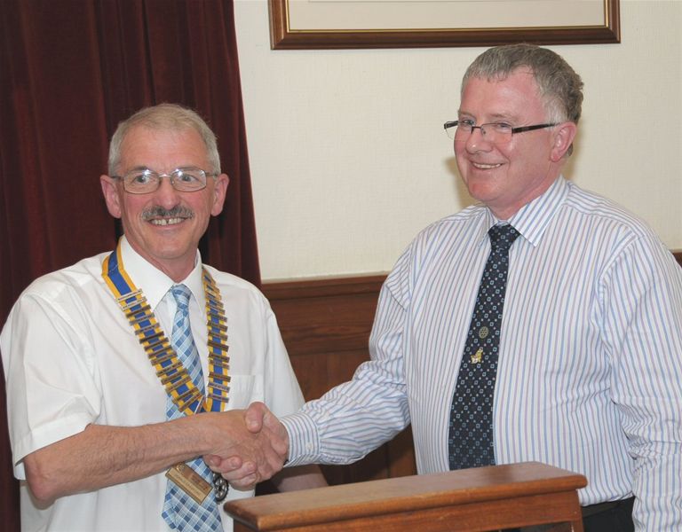 Club Assembly & Installation - President Donald Crawford being congratualted b outgoing President Norman Pettigrew.