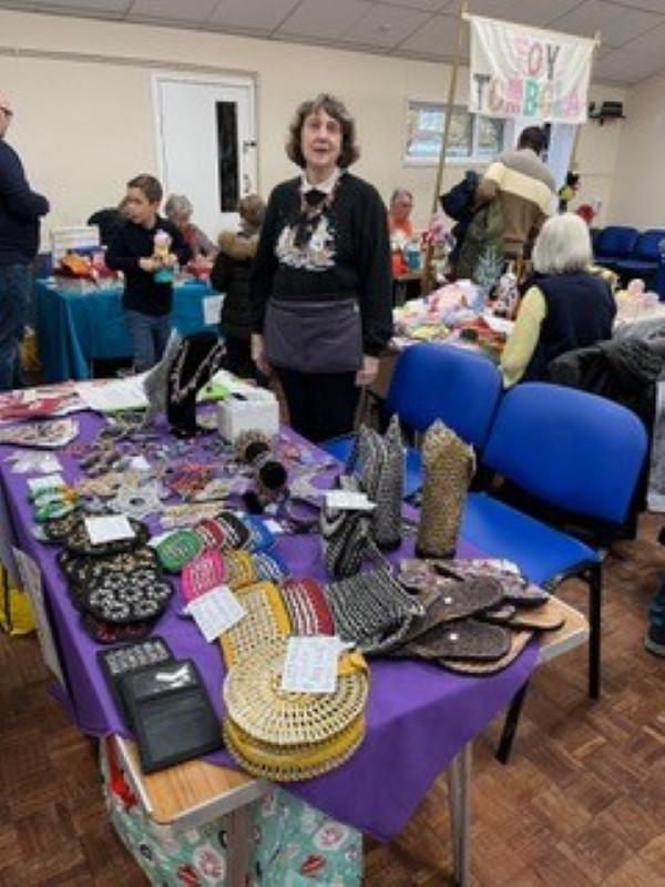 Wendy selling the Purple Community Jewelry at a recent Christmas Sale.