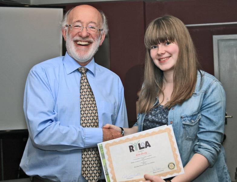 Erin Brolly, one of our RYLA candidates visits us. - Erin is presented with her RYLA group picture and a certificate by Club President Gordon Sanders