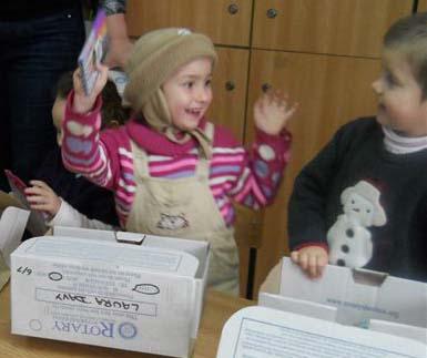 2013 Rotary Shoeboxes delivered in Romania - This little girl is delighted with her present.