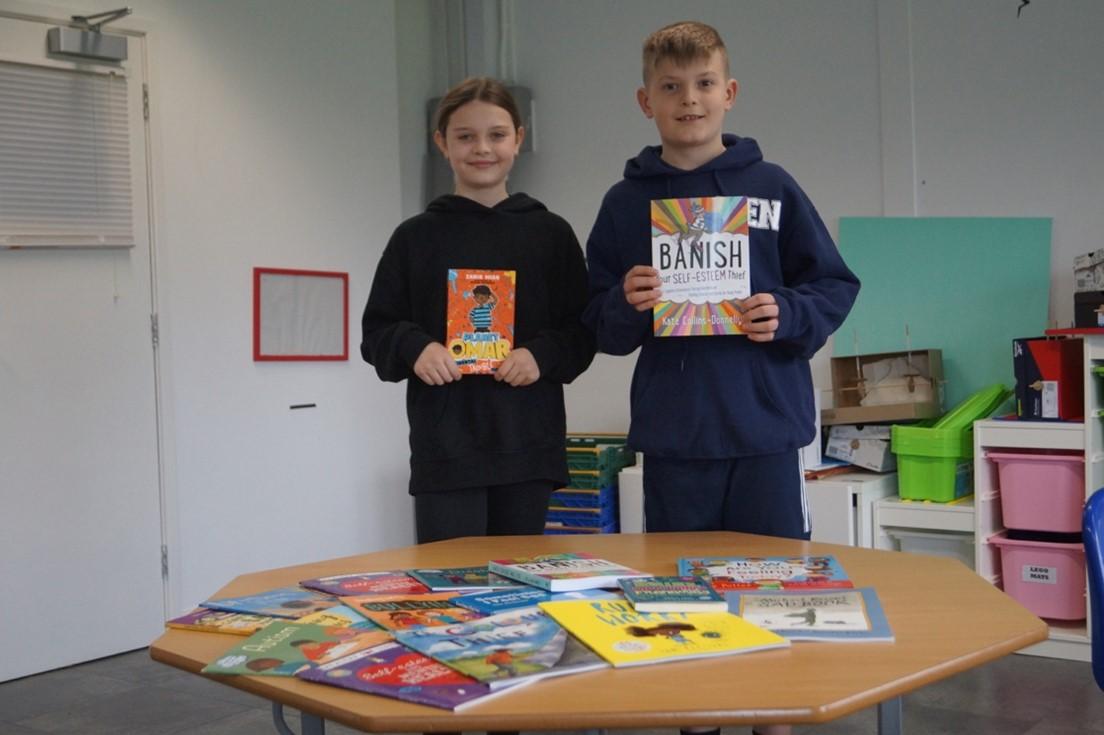 Students showing of the new books