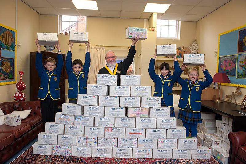  Rotary Shoebox Scheme at St Margaret's School Gosfield  - Vice President Mike Prince with pupils from St Margaret's 