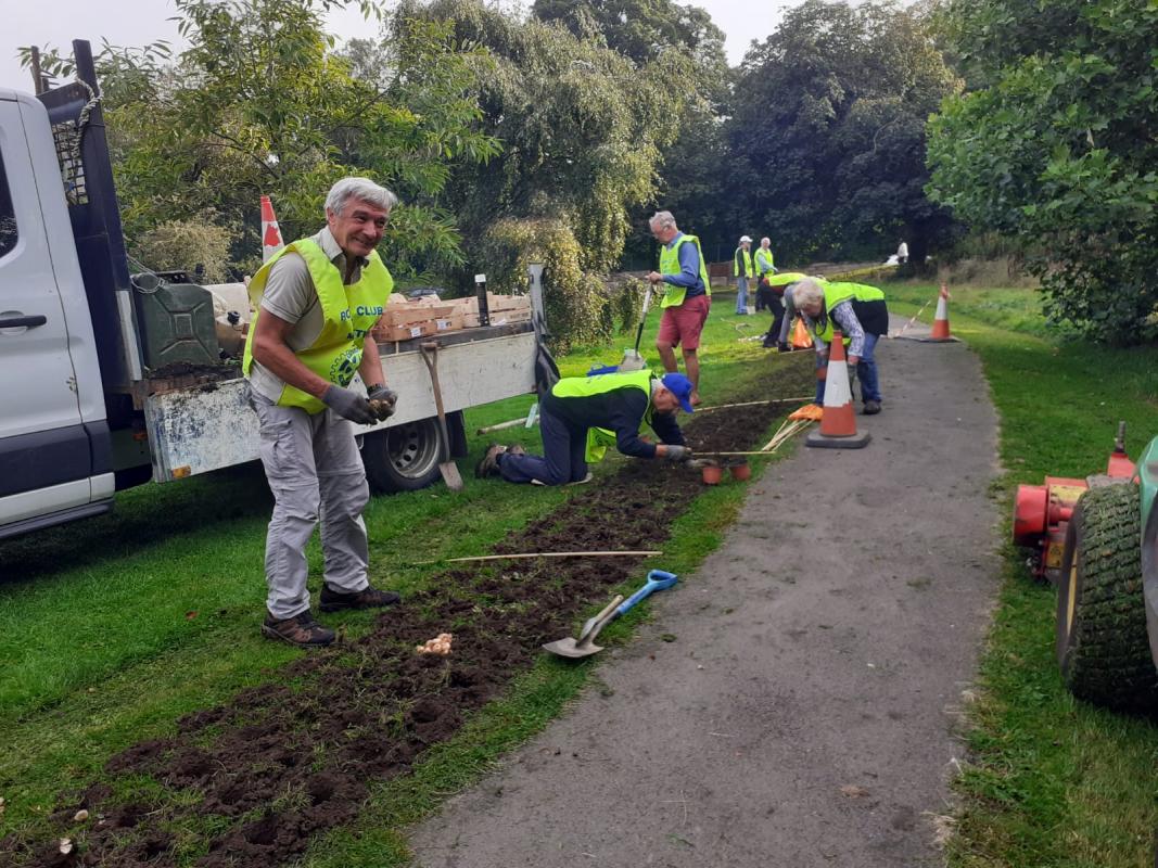 Rotarians planting Crocuses in Deuchar Park in support of this project to refresh the Teardrop Garden at Wansbeck Hospital.