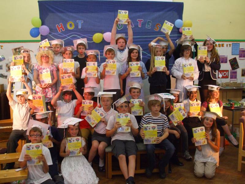 Dictionaries for Life! - Pupils at Towngate J & I School hold their dictionaries high!