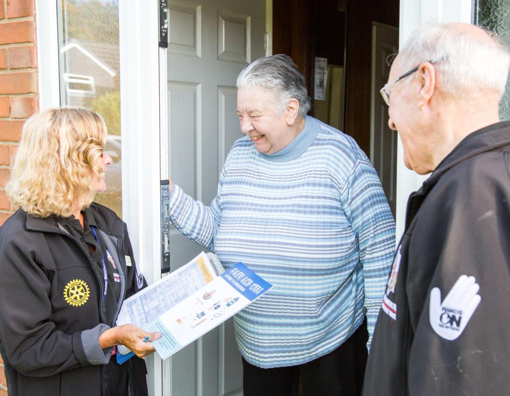 The photograph shows Mrs Yvonne Valentine with Rotary team members Yvonne Frazer-Bastable and Dennis Hobson.