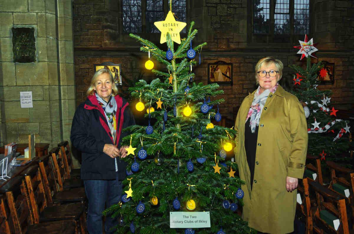 Member Helen Buswell admires the work of Member Jo Jarvis (right)