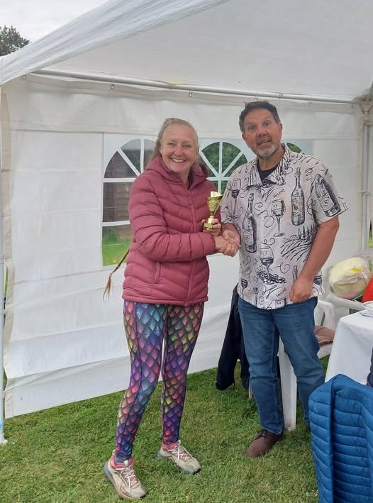 Ruth receiving her trophy for winning the treasure hunt.