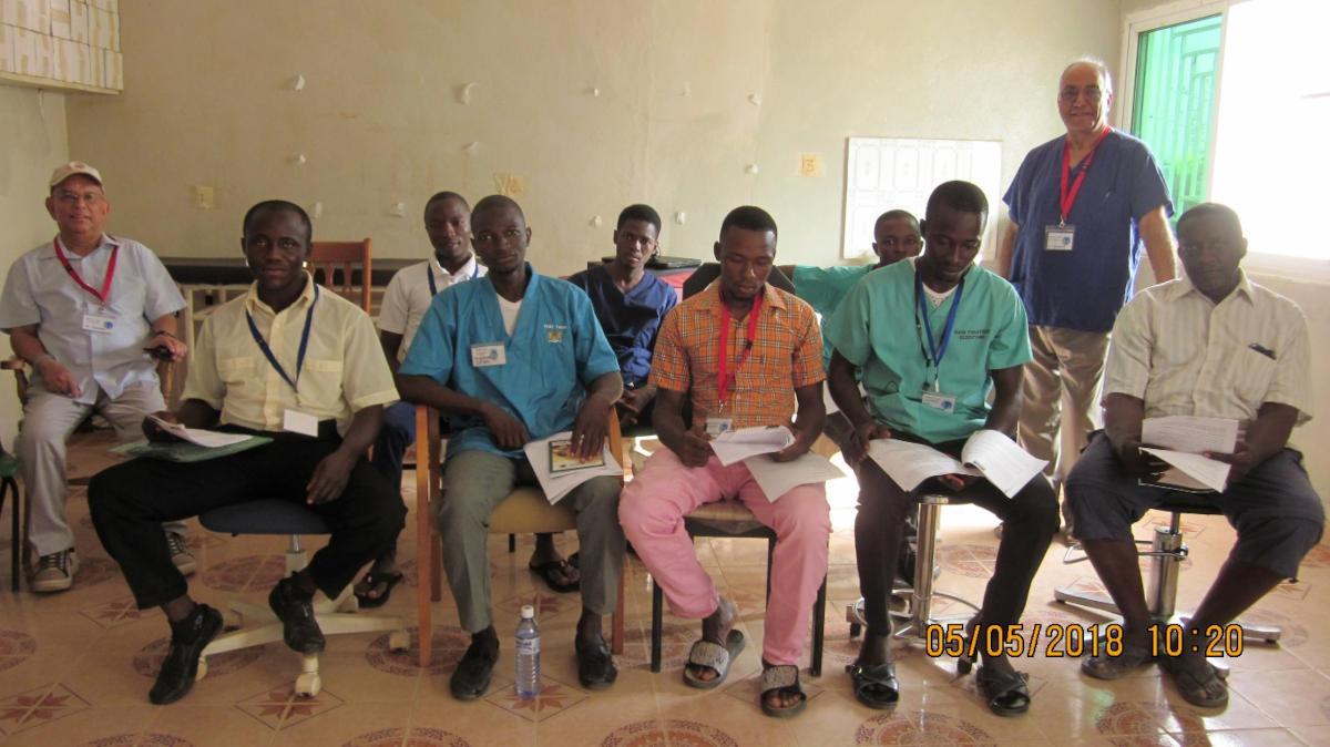 A line of  seated African medics, with two of our Club members.