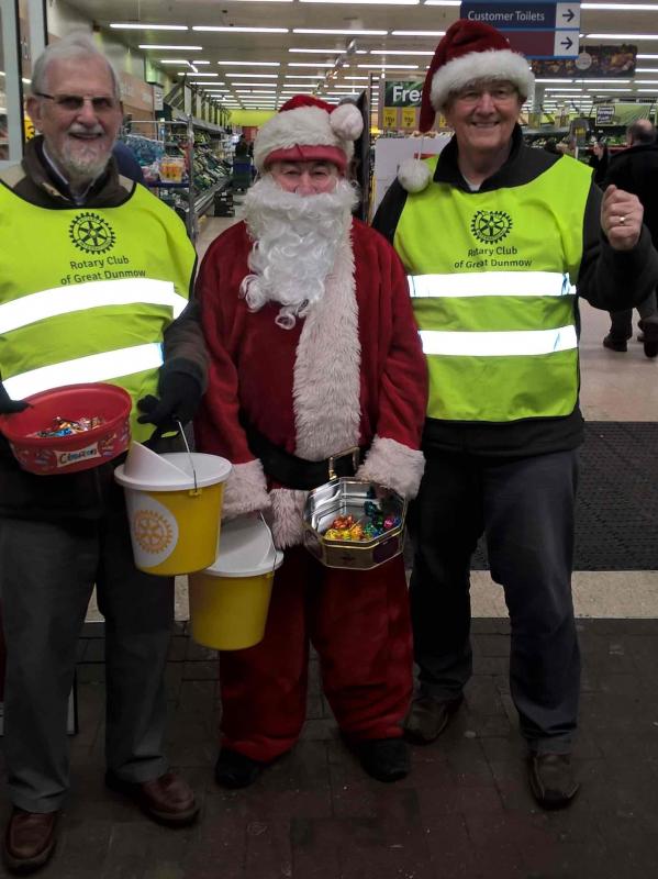 Rotary of Dunmow members and Santa fund raising for charity at Tesco.