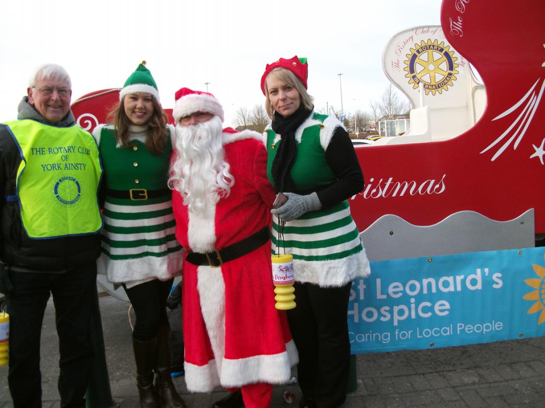 York Ainsty Santa's Sleigh - St Leonard's Hospice 'Elves' with Santa, Rtn John Niklaus and the Sleigh.