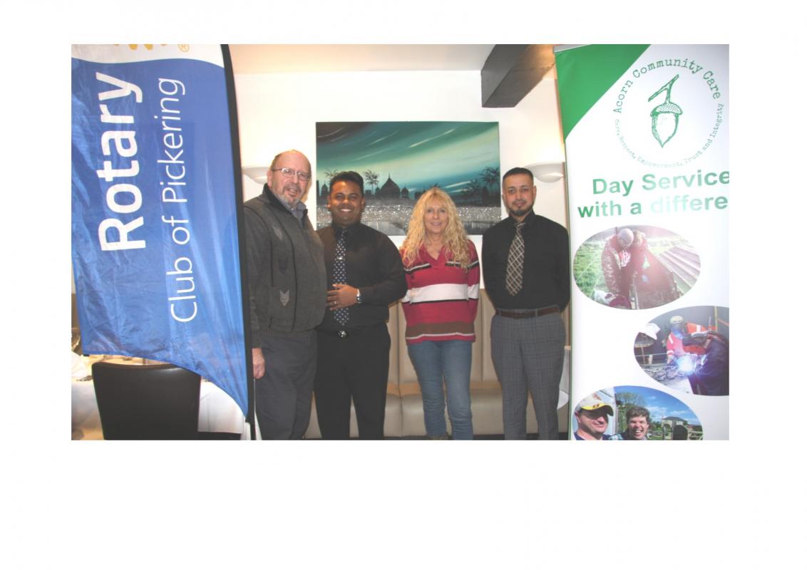 Rob Thomas, President of the Rotary Club; Alison Cashmore from Acorn Community, together with Asab and Abdul of Spice 4U