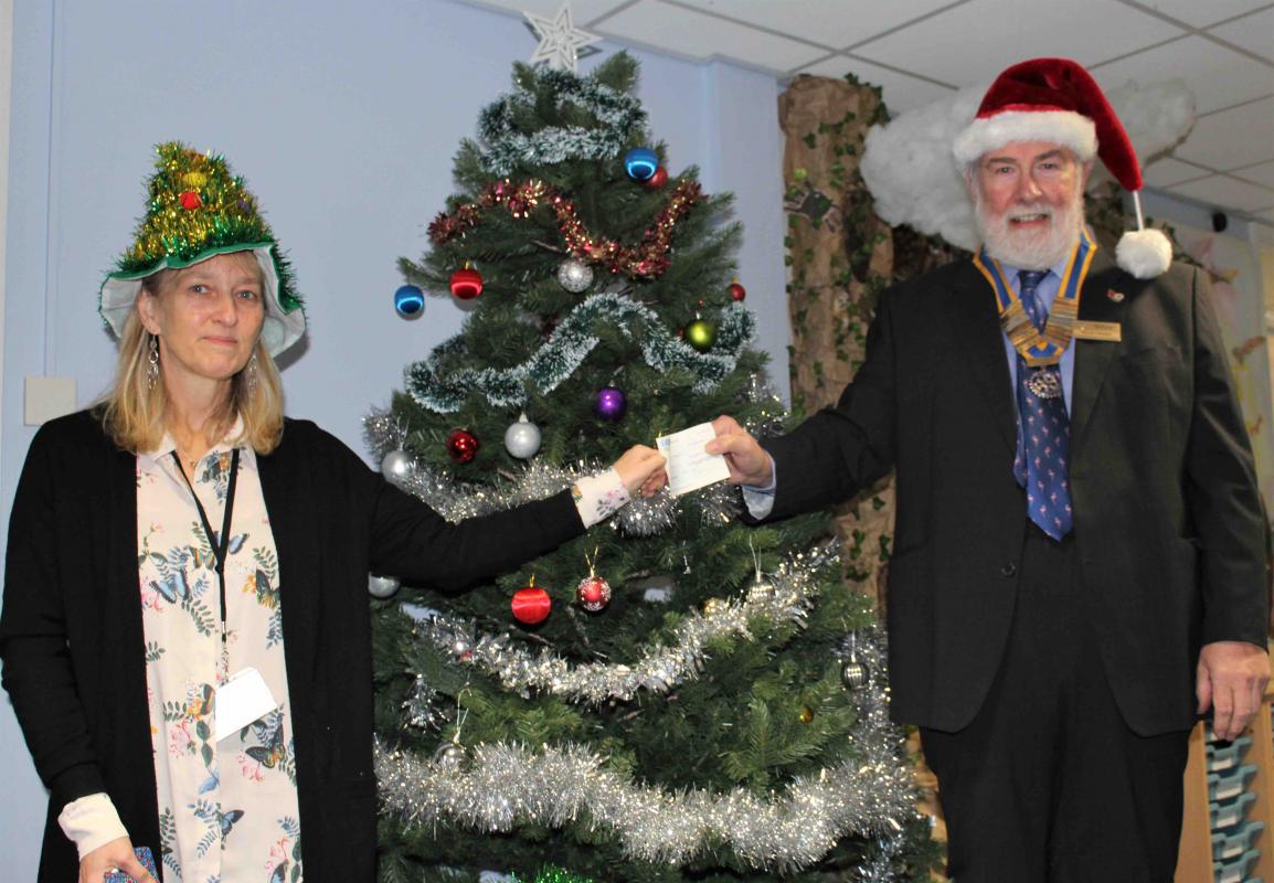 Presentation of a cheque to Head Teacher, Clare Griffiths, of Dunmow St Mary's Primary School, by Dunmow Rotary President Willie Fraser. 