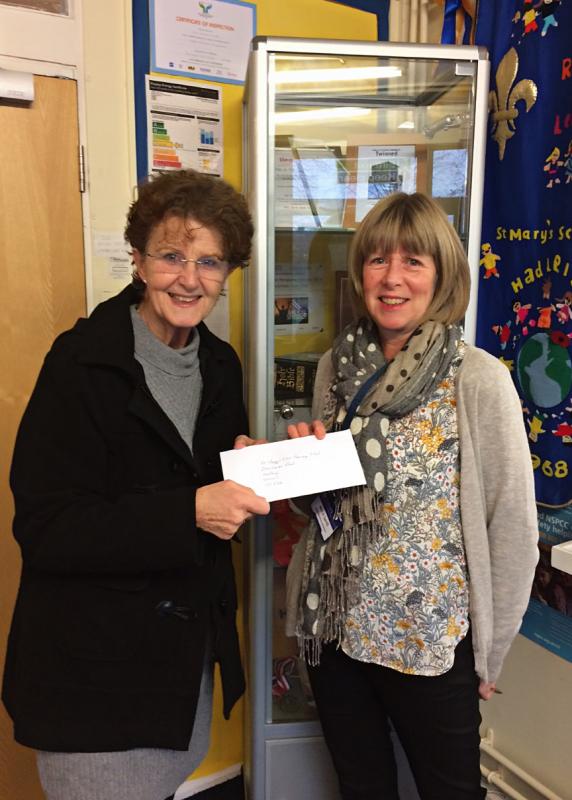 Donation Hand over to Ali, St. Mary's Primary School Secretary 