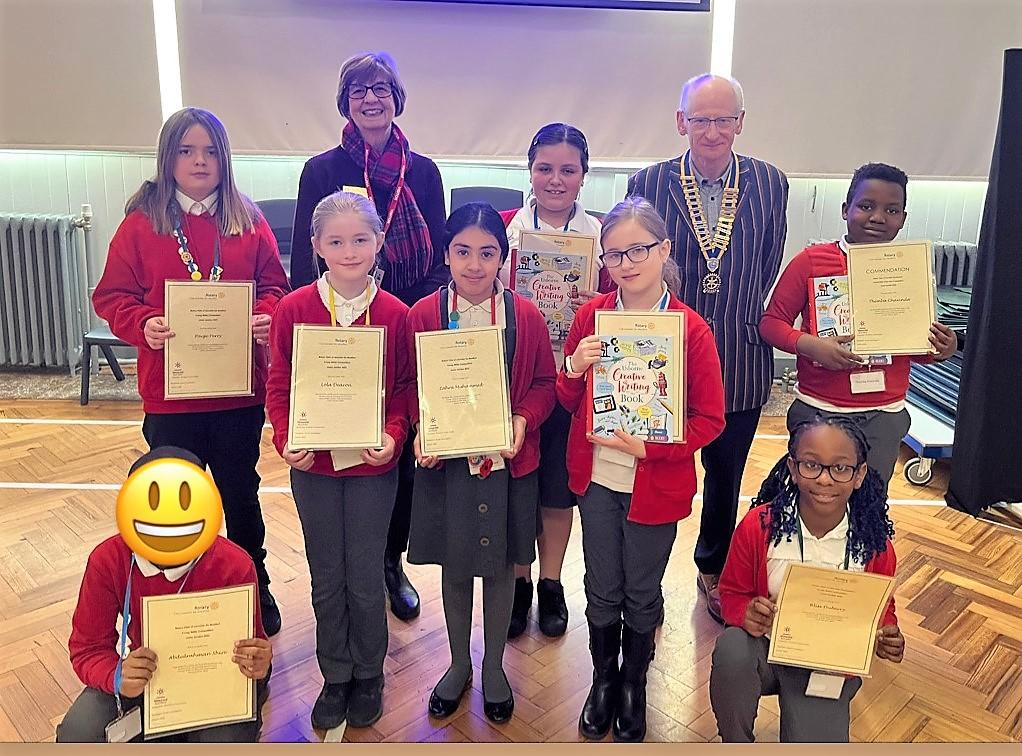 Charities/Good Causes Supported - Esme Pridmore is the School winner, (standing between Linda and Stuart). She received a book token, a creative writing book and the Rotary certificate. Club