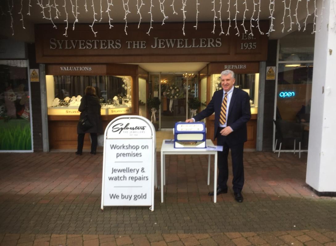 Phil Sylvester makes the draw outside his business in Talisman Square