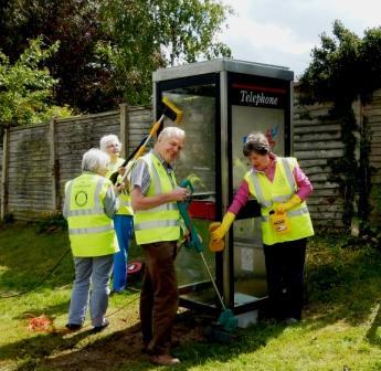 The team hard at work preparing the old phone box