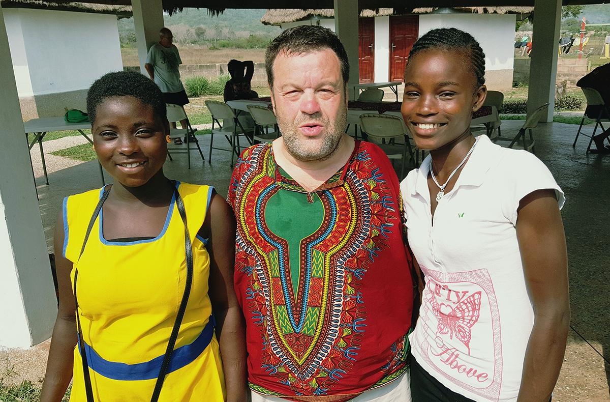 Tom with two girl students