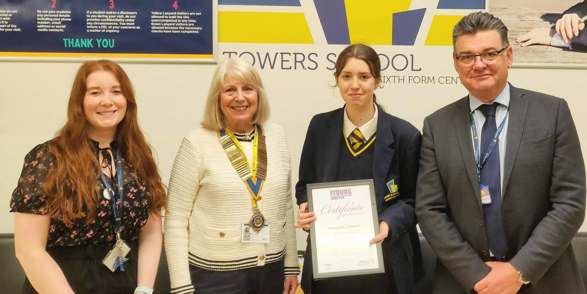 Club President, Renate presents Towers School pupil, Megan Tasker with the First Prize Certificate for the local level of the ‘Young Writer of the Year’ 