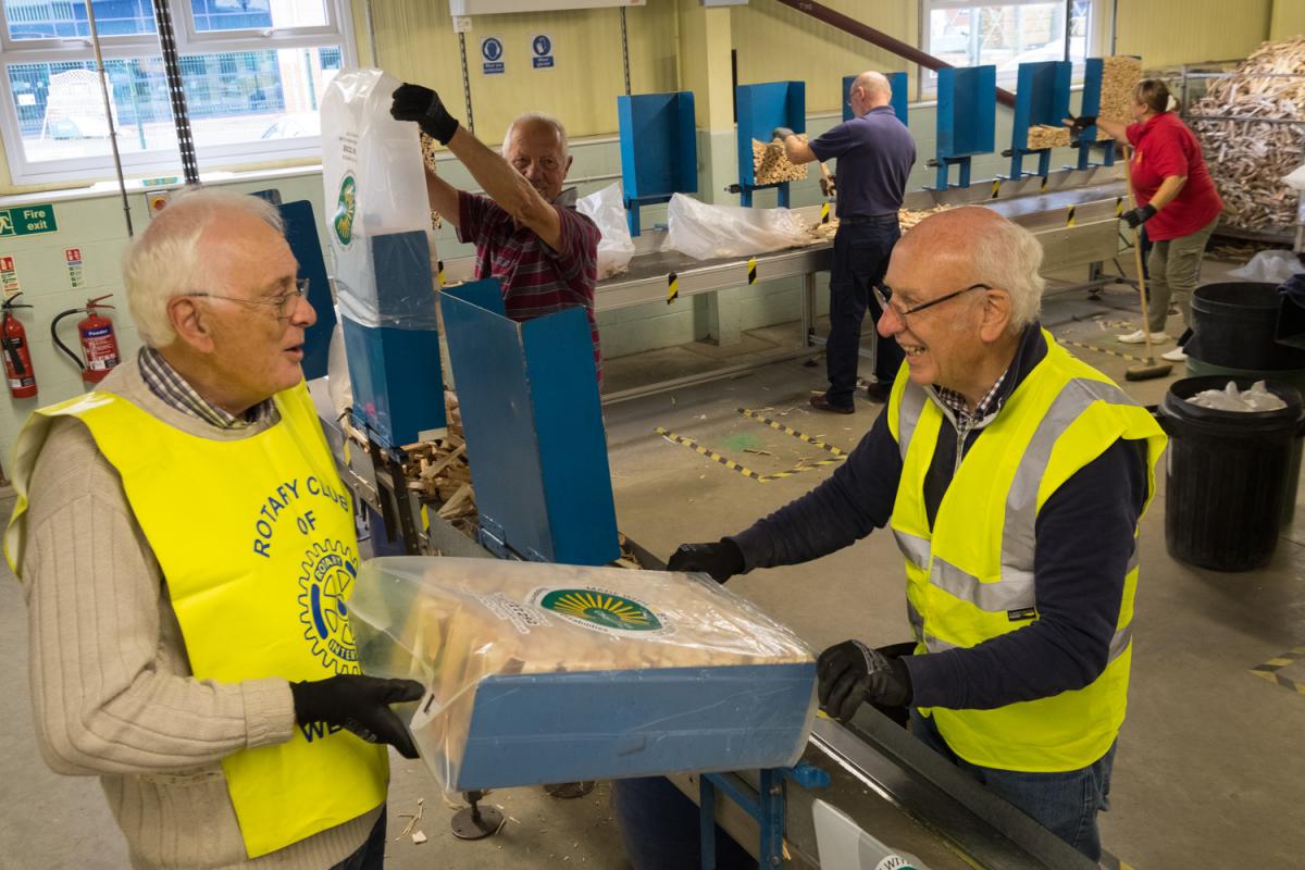 Rotary helps Chopsticks Charity - David Blakeley and John Morton packing sticks