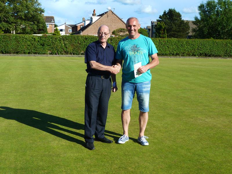 Beer Festival Bowling Tournament - Winner of the Bowl Tournament Warren Pinson receives his £150 prize from past president Barrie Swan