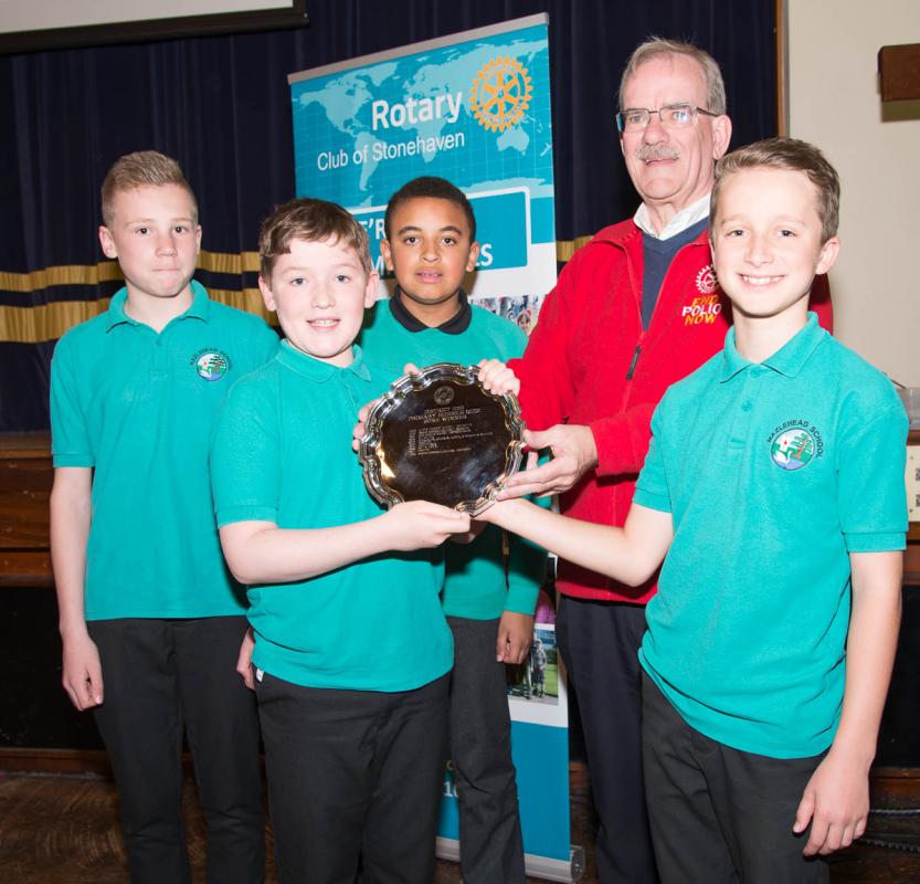 Primary Schools Quiz - Area 4 Final - Assistant Governor, Ken McLennan presents winners, Hazlehead School, with their trophy