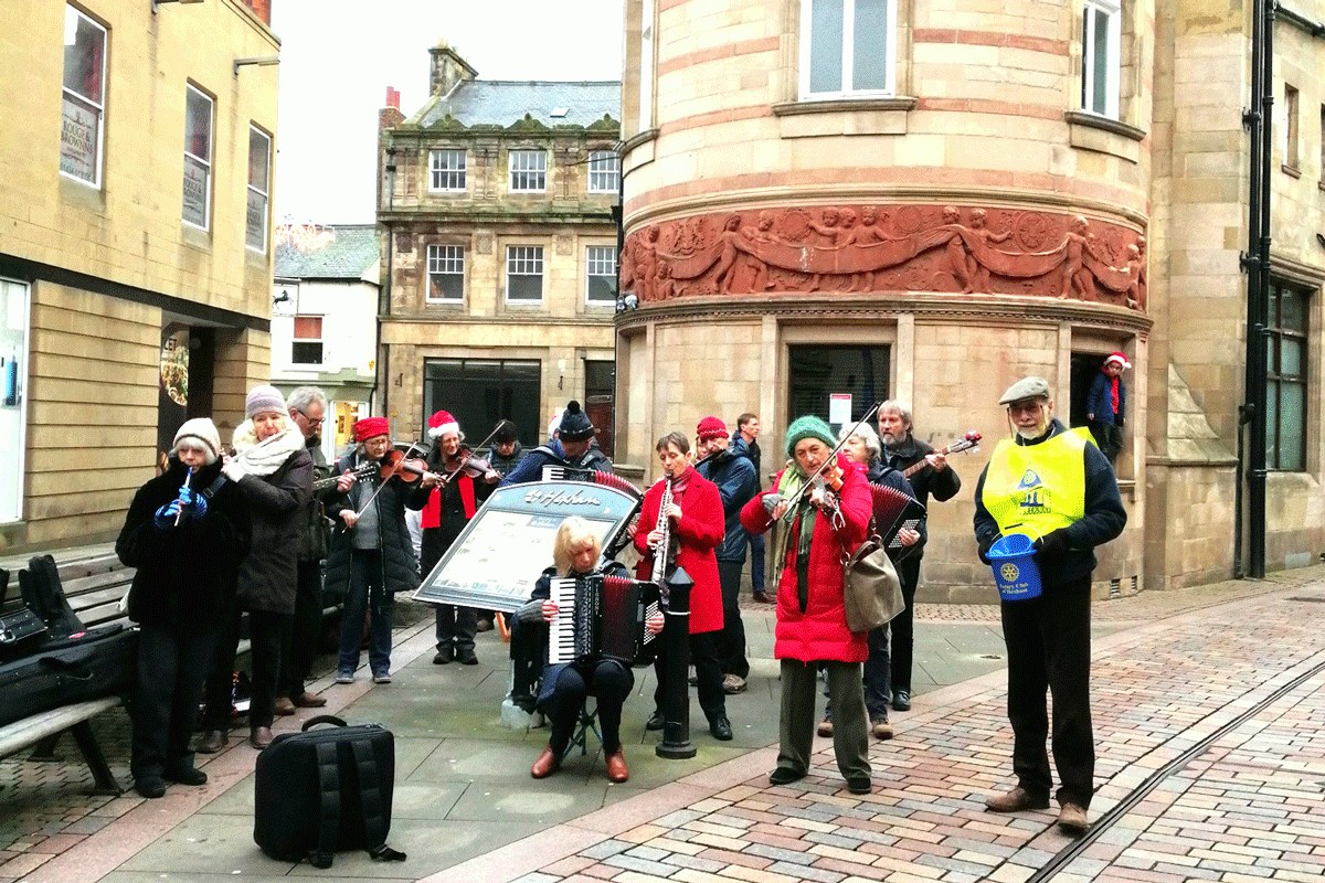 Collecting in Fore Street with the carols in the background