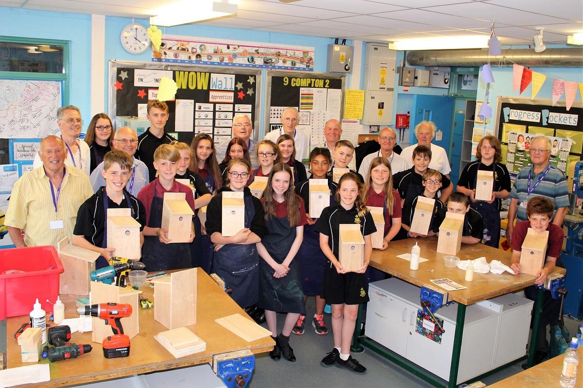 The Rotary inspired RWB Men's Shed in community action - Students showing their bird boxes with Men's Shed members at the RWB Academy Success Lounge