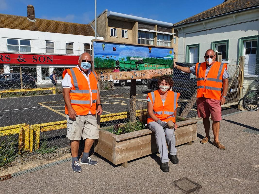 Andy, Ian and Di proudly display one of the updated planters.