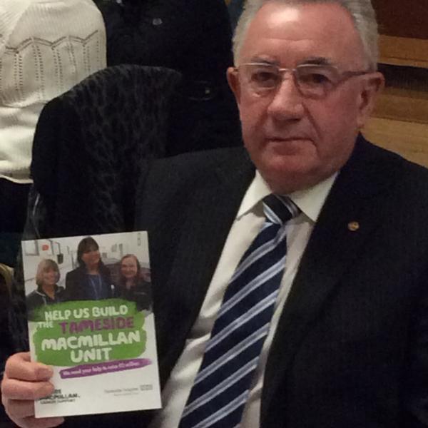 Rtn Derek Baines with leaflet promoting Tameside MacMillan Unit