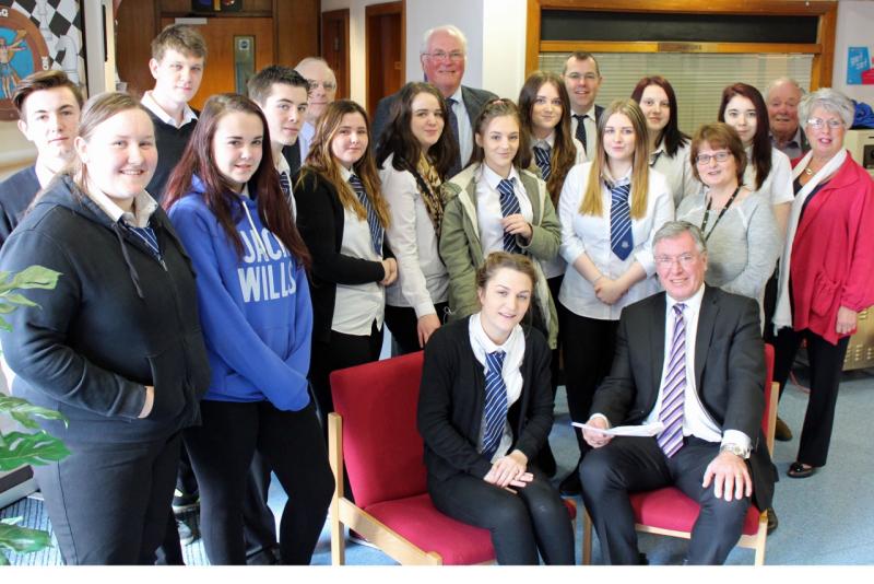 Picture shows student Chloe West being interviewed by Cadham Consultantcy Managing Director Bill Harley. Looking on are a group of students and Rotarians. Also in the picture is Paul O