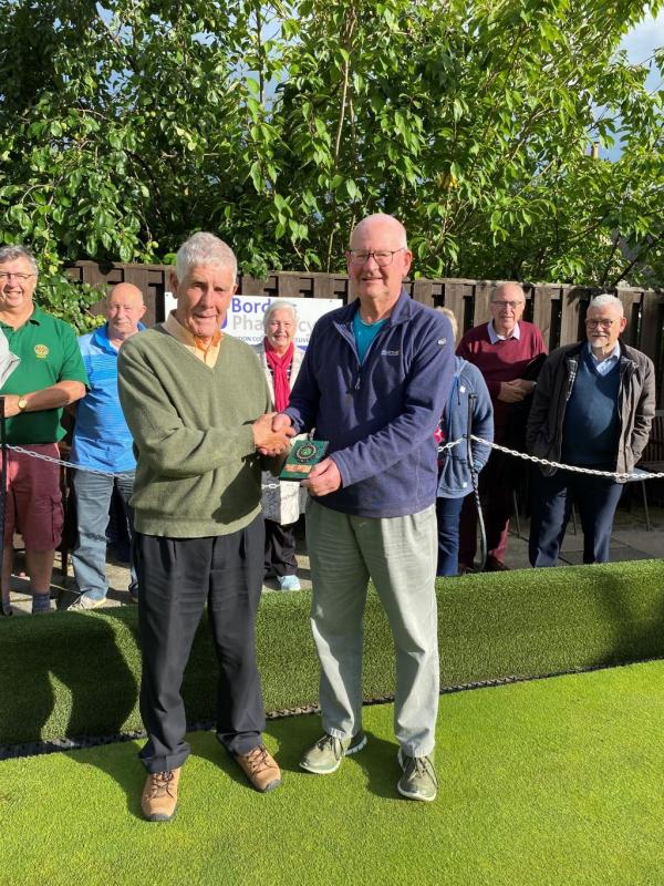 President Ron presents Champion Scott with his trophy.