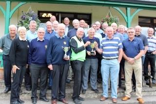 Picture shows John Carpenter of Lockerbie (Left) with Andy McMinn and Ivor Waddell of the Kirkcudbright team receiving their winner