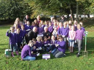 The Bishops C of E Learning Academy School planted 10,000 purple crocuses in Trenance Gardens,
