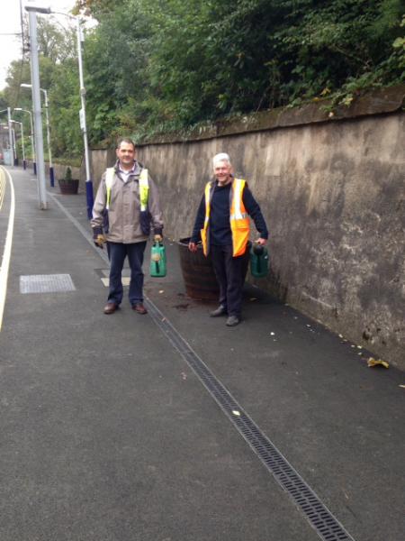 Cambuslang Rotarians in action at local station - Club members Tony Neeson & Nigel Wunsch show off their green fingers!