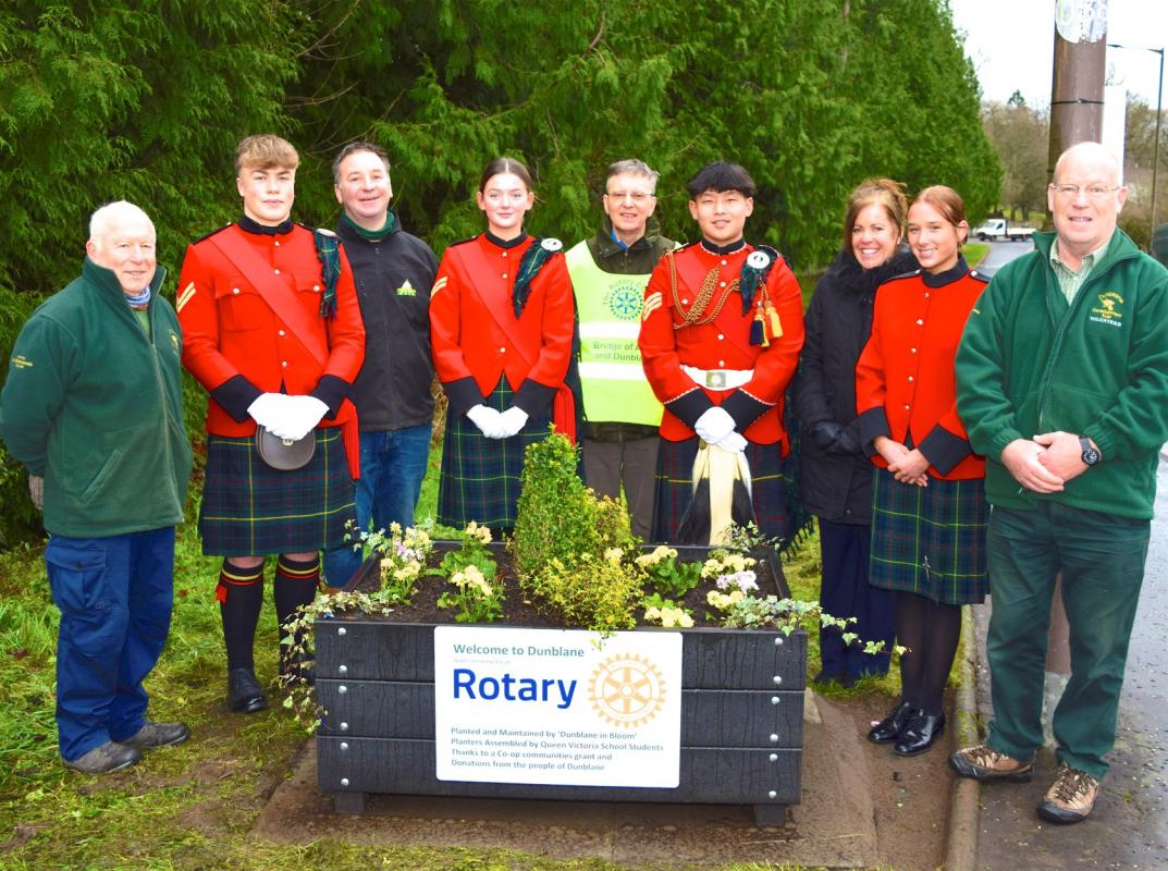 Planters - At the celebration of the completion by Interactors from Queen Victoria School of 40 planters for Dunblane: (l to r) George Matthews (Dunblane in Bloom), Euan Lee, George Morrison of Molawn, Interact President Lily O’Neill, Rotarian President Russell