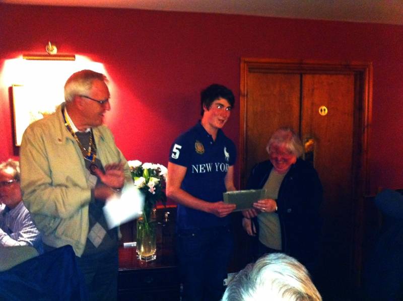 President John Ogbourne presenting the certificate to Sam