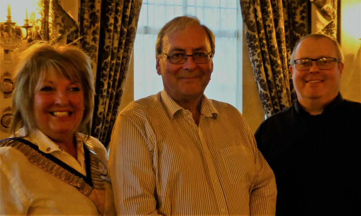 Photos show speaker Denis Rattenbury flanked by Edith and Stephen Cooper