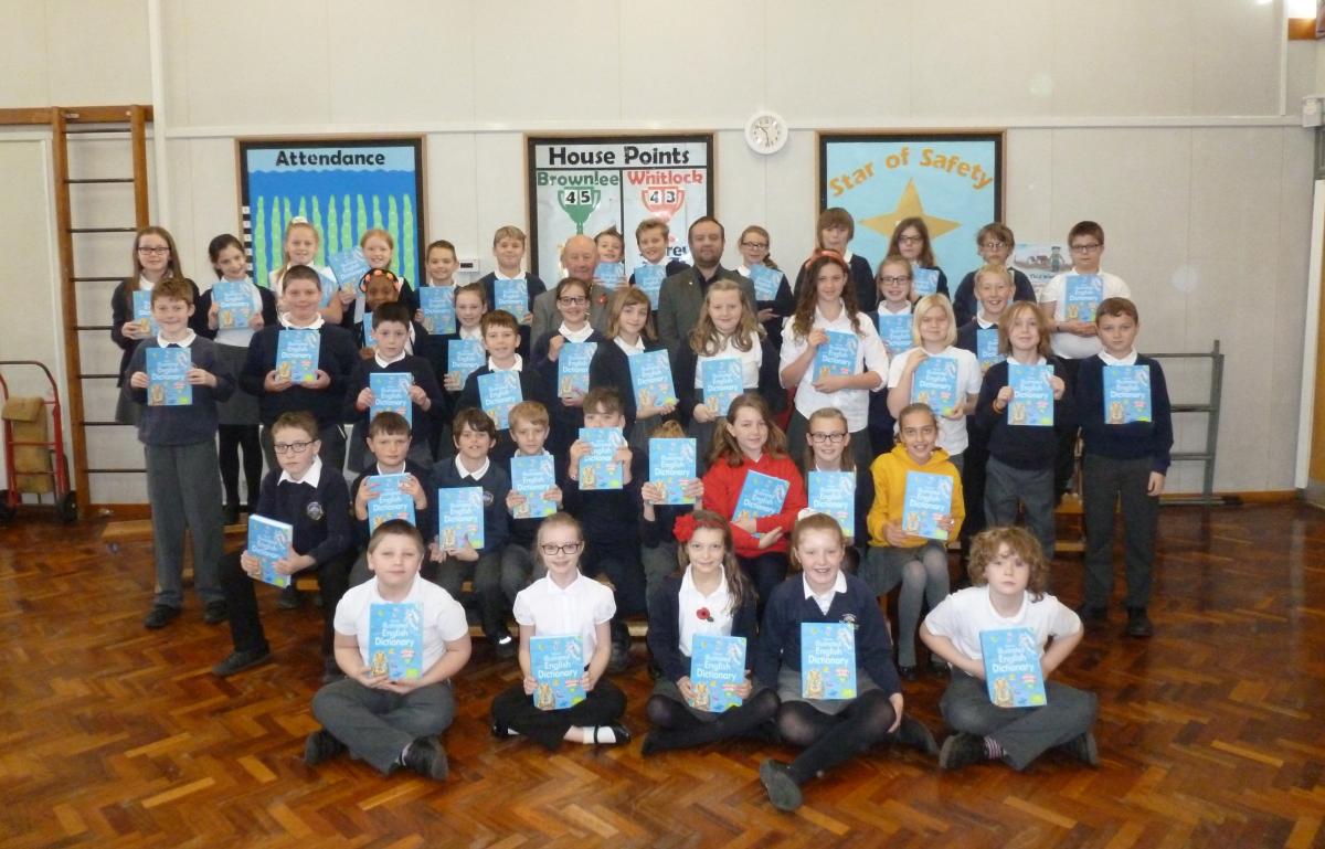 DICTIONARIES 4 LIFE - In our picture Dick Wood (l) and Glyn Denton (r) can be spotted among the year 6 pupils at the school.