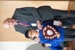 Dominic Wong accepting the 2019 Pupil of the Year Award from Alsager Rotarian Ron Tyson