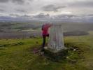 Pat Sutherland at a triangulation pillar or 'trig point'