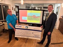 President Martin Stibbards presents our cheque for £3,375 to Peter Hennessey of the Essex and Herts Air Ambulance Trust