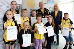 Rotary Club Vice President Ann Debureaux-Dias with some of the entrants from the Swindon Dolphins ASC