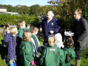 Children with teacher, and Rtn Phil Oliver