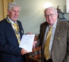 Bobby Cairns receives his Honorary Membership certificate