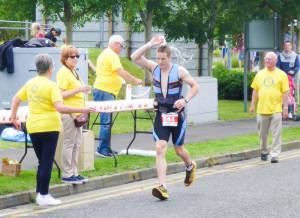 Club Members running a water station for Ironman Runners