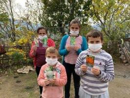 A group of children in Librazhd with the donated seeds for planting. 